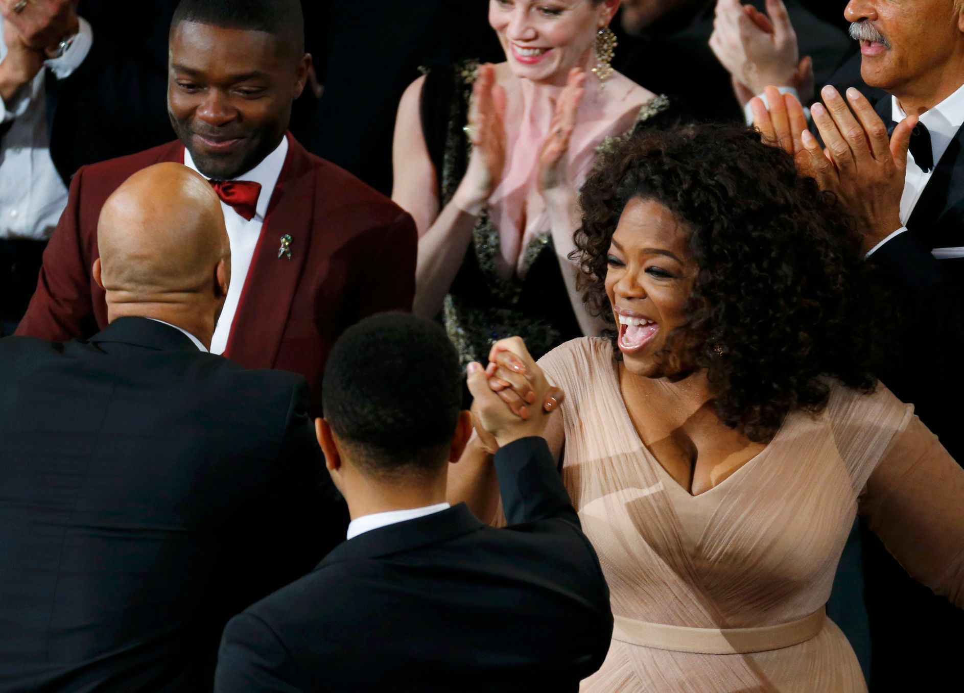 Winfrey and Oyelowo congratulate Legend and Common after &quot;Glory&quot; won the Oscar for best original song during the 87th Academy Awards in Hollywood