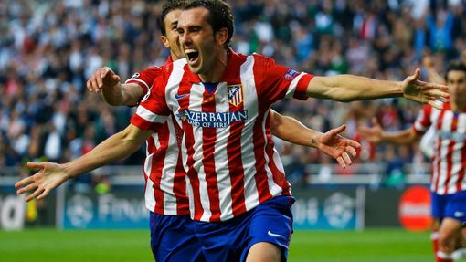 Atletico Madrid's Diego Godin celebrates after scoring a goal against Real Madrid during their Champions League final soccer match at Luz stadium in Lisbon, May 24, 2014.