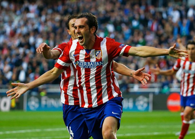 Atletico Madrid's Diego Godin celebrates after scoring a goal against Real Madrid during their Champions League final soccer match at Luz stadium in Lisbon, May 24, 2014.