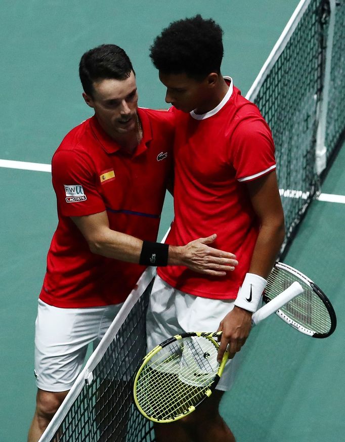 Tennis - Davis Cup Finals - Final - Caja Magica, Madrid, Spain - November 24, 2019   Spain's Roberto Bautista Agut with Canada's Felix Auger-Aliassime after winning their