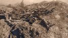 Dead British soldiers are pictured at a machine gun position on the Western Front in this 1918 handout picture.