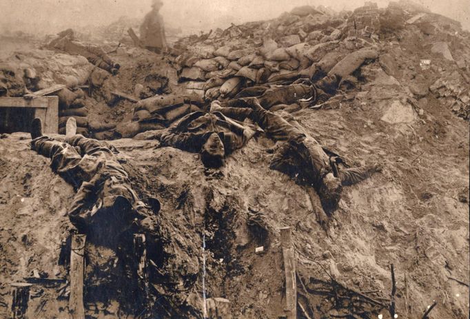 Dead British soldiers are pictured at a machine gun position on the Western Front in this 1918 handout picture.