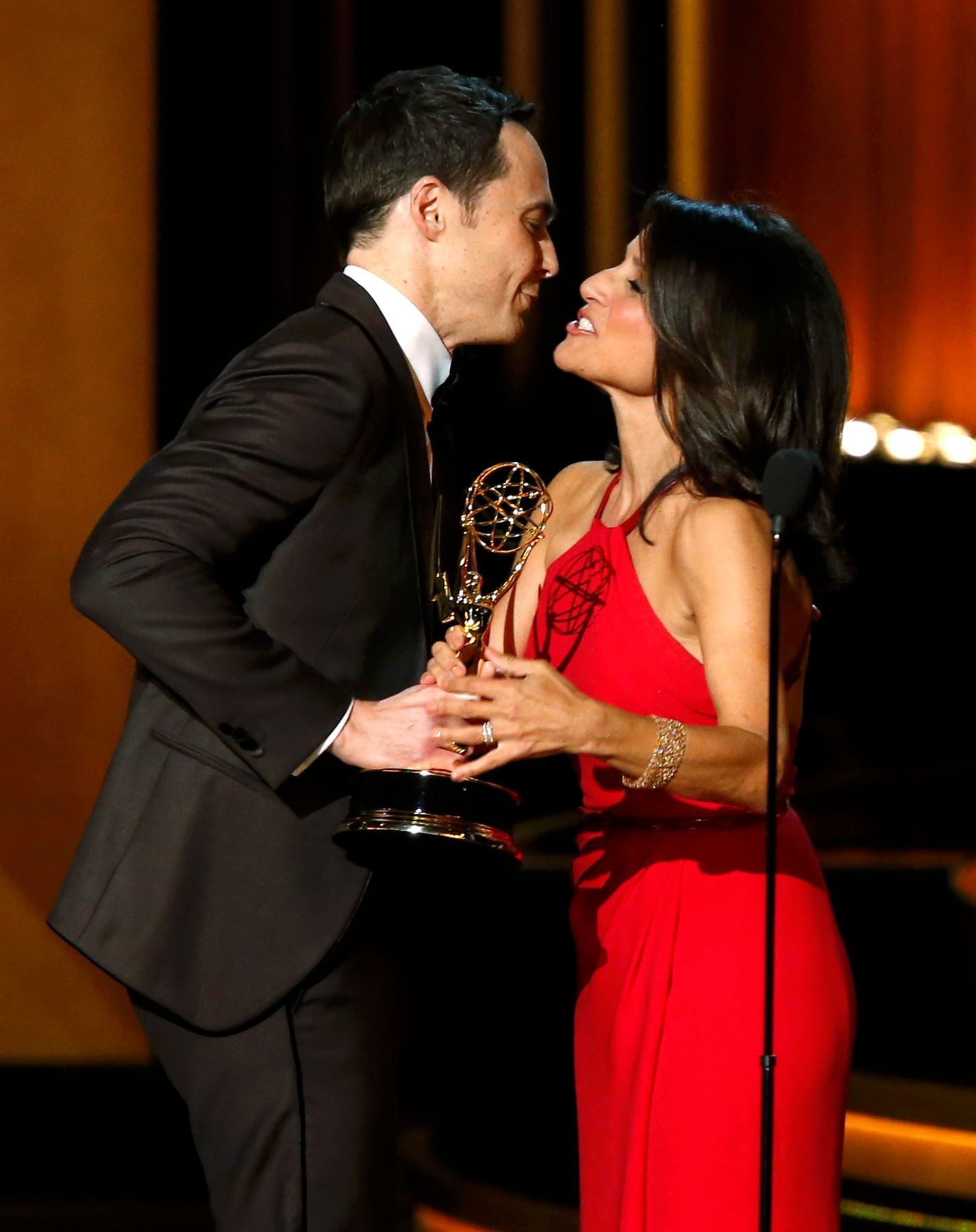 Jim Parsons accepts the award for Outstanding Lead Actor In A Comedy Series for his role in &quot;The Big Bang Theory&quot; from presenter Julia Louis-Dreyfus onstage during the 66th Primetime Emmy Aw