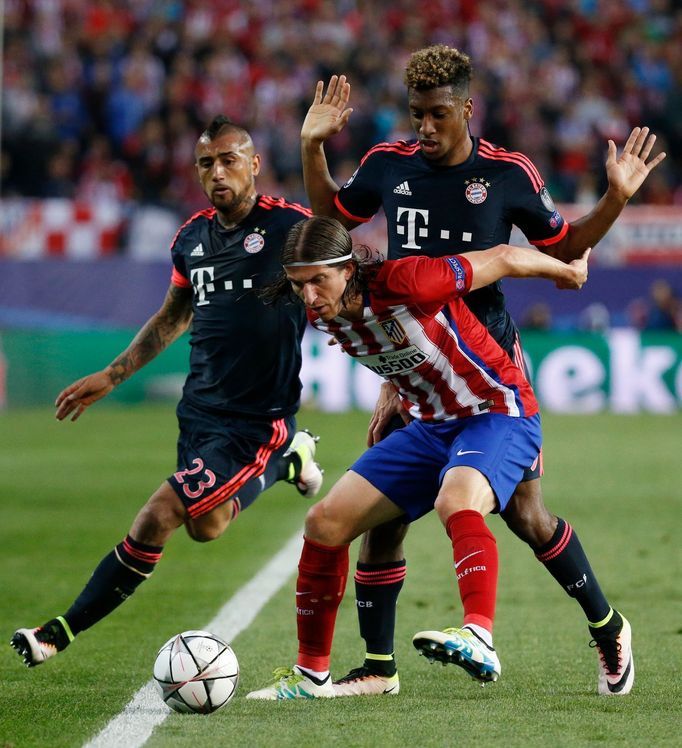 Bayern Munich's Kingsley Coman in action with Atletico Madrid's Filipe Luis