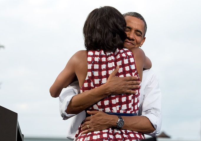 Aug. 15, 2012 "The President hugs the First Lady after she had introduced him at a campaign event in Davenport, Iowa. The campaign tweeted a similar photo from the campaign photographer on election night and a lot of people thought it was taken on election day