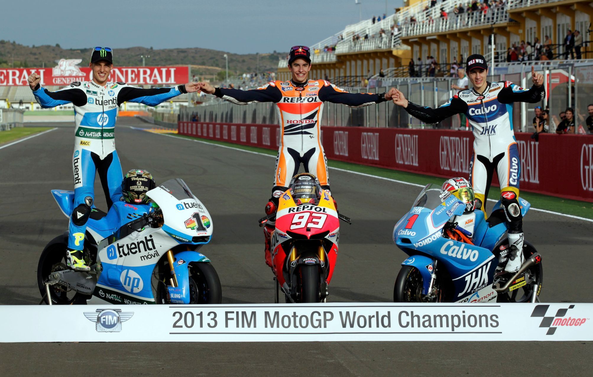 Spanish World Champions Honda MotoGP rider Marquez, Suter Moto2 rider Espargaro and KTM Moto3 rider Vinales pose at the end of the Valencia Motorcycle Grand Pri in Cheste