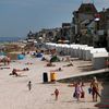Tourists enjoy the sunshine on the former Juno Beach D-Day landing zone in Saint-Aubin-sur-Mer