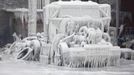 A truck is encased in ice, after a warehouse fire in Chicago January 23, 2013. Fire department officials said it is the biggest fire the department has had to battle in years and one-third of all Chicago firefighters were on the scene at one point or another trying to put out the flames. An Arctic blast continues to grip the U.S. Midwest and Northeast Wednesday, with at least three deaths linked to the frigid weather, and fierce winds made some locations feel as cold as 50 degrees below zero Fahrenheit. (minus 46 degrees Celsius). REUTERS/John Gress (UNITED STATES - Tags: DISASTER ENVIRONMENT) Published: Led. 23, 2013, 5:53 odp.