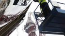 Workers install a large convex mirror which reflects the Olympic Stadium at a sponsor's stand in Stratford, east London, July 14, 2012. The London 2012 Games are due to open in less than two weeks. REUTERS/Andrew Winning (BRITAIN - Tags: SPORT OLYMPICS BUSINESS EMPLOYMENT) Published: Čec. 14, 2012, 1:52 odp.