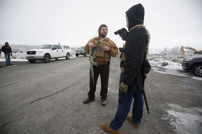 Members of the Pacific Patriots Network set up a temporary security perimeter while a meeting takes place at the Malheur National Wildlife Refuge near Burns