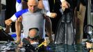 French athlete Philippe Croizon, whose arms and legs were amputated after an electric shock accident in March 1994, is helped by an unidentified divers to enter a 33 metre (36 yard) deep pool, the world's deepest pool built to train professional divers, at Nemo33 diving centre in Brussels January 10, 2013. Croizon, who swam with adapted prostheses that had flippers attached, broke a world record and became the first disabled person to dive to 33 metres, according to the organisers. REUTERS/Yves Herman (BELGIUM - Tags: SOCIETY SPORT DIVING) Published: Led. 10, 2013, 3:49 odp.