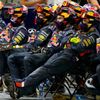Members of the Red Bull Formula One team watch the Bahrain F1 Grand Prix at the Bahrain International Circuit (BIC) in Sakhir