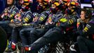 Members of the Red Bull Formula One team watch the Bahrain F1 Grand Prix at the Bahrain International Circuit (BIC) in Sakhir, south of Manama April 6, 2014. REUTERS/Patr