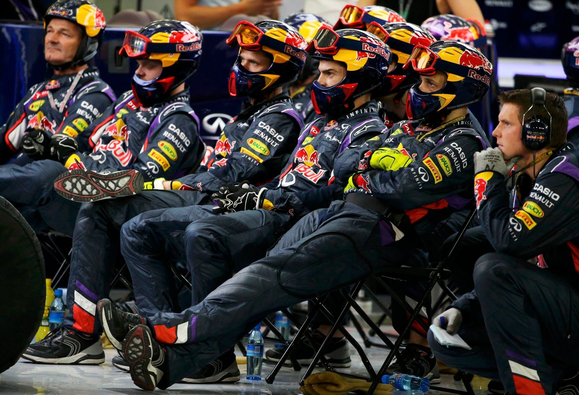 Members of the Red Bull Formula One team watch the Bahrain F1 Grand Prix at the Bahrain International Circuit (BIC) in Sakhir