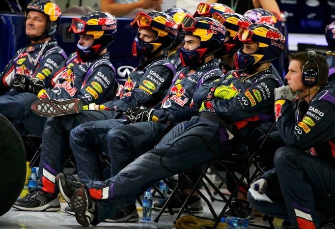 Members of the Red Bull Formula One team watch the Bahrain F1 Grand Prix at the Bahrain International Circuit (BIC) in Sakhir, south of Manama April 6, 2014. REUTERS/Patr