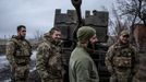 Service members of Ukrainian Joint Assault Brigade Fury stand next to an S60 cannon near the front line town of Bakhmut, amid Russia's attack on Ukraine, in Donetsk regio