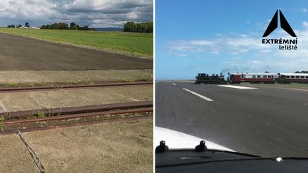 Železniční trať uprostřed dráhy. Letištěm projíždí několikrát denně motorák