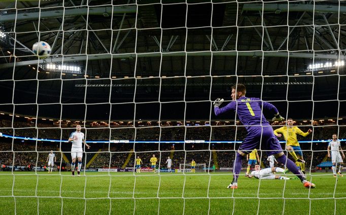 Sweden's Marcus Berg scores the opening goal against Czech Republic's goalkeeper Tomas Vaclik during the friendly international soccer match at the Friends Arena in Sto