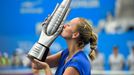 Kvitova of the Czech Republic kisses the trophy after winning the women's singles final match against Bouchard of Canada at the Wuhan Open Tennis Tournament, in Wuhan