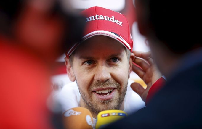 Ferrari F1 driver Sebastian Vettel speaks to media in the paddock.