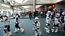 A group of young Star Wars Stormtroopers walk inside the Convention Center at the 2015 Comic-Con International in San Diego