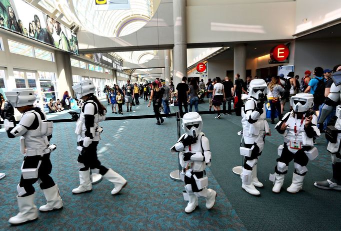 A group of young Star Wars Stormtroopers walk inside the Convention Center at the 2015 Comic-Con International in San Diego