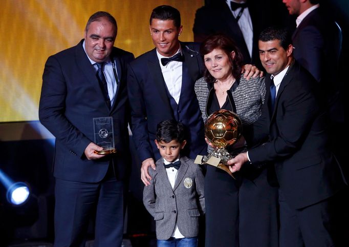 FIFA Ballon d'Or winner Cristiano Ronaldo (C) poses with his mother Maria Dolores dos Santos Aveiro (2nd R) and son Cristiano Ronaldo Jr. after the FIFA Ballon d'Or 2014