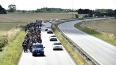 Syrští uprchlíci na dánské dálnici.