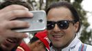 Williams F1 driver Felipe Massa takes a picture with a fan at the Australian Formula One Grand Prix in Melbourne. REUTERS/Brandon Malone