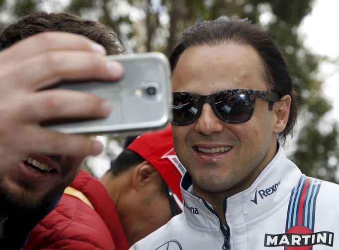 Williams F1 driver Felipe Massa takes a picture with a fan at the Australian Formula One Grand Prix in Melbourne. REUTERS/Brandon Malone