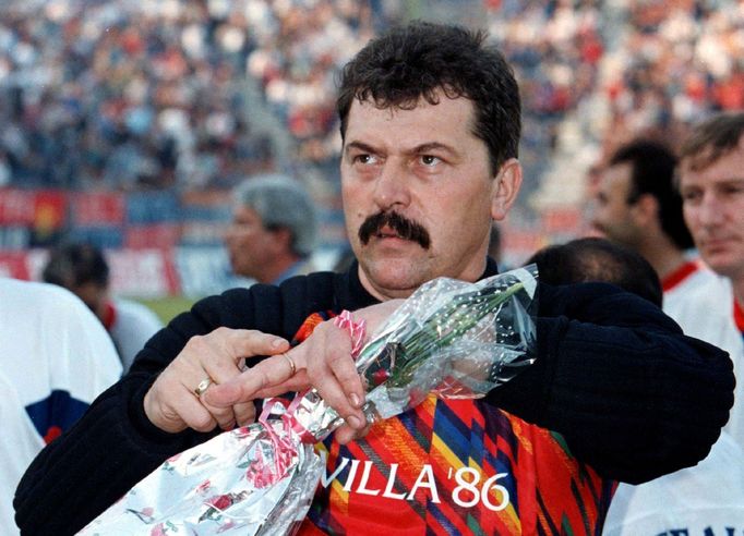 FILE PHOTO: Steaua Bucharest goalkeeper Helmuth Duckadam gestures after he receives flowers from fans at the start of the anniversary rematch of the 1986 European Cup fin