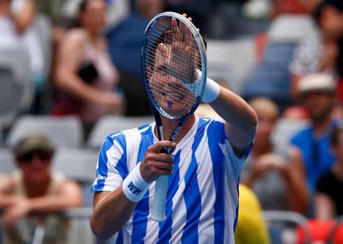 Tomas Berdych of Czech Republic celebrates defeating Damir Dzumhur of Bosnia and Herzegovina in their men's singles match at the Australian Open 2014 tennis tournament in