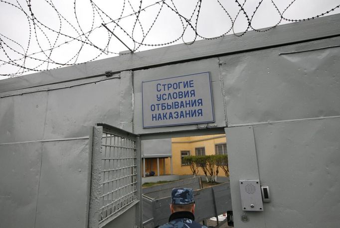 An officer enters a zone where especially strict conditions are imposed inside a high-security male prison camp outside Russia's Siberian city of Krasnoyarsk May 14, 2013