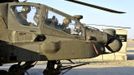 Britain's Prince Harry (R) sits in the cockpit of his Apache helicopter in Camp Bastion, southern Afghanistan in this photograph taken November 3, 2012, and released January 21, 2013. The Prince, who is serving as a pilot/gunner with 662 Squadron Army Air Corps, is on a posting to Afghanistan that runs from September 2012 to January 2013. Photograph taken November 3, 2012. Photograph pixelated at source. REUTERS/John Stillwell/Pool (AFGHANISTAN - Tags: MILITARY POLITICS SOCIETY ROYALS CONFLICT) Published: Led. 21, 2013, 7:52 odp.