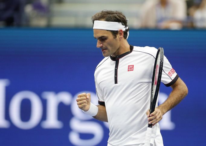 Aug 28, 2019; Flushing, NY, USA; Fans take photos of Roger Federer of Switzerland celebrates match point against Damir Dzuhmur of Bosnia and Herzegovina in a second round