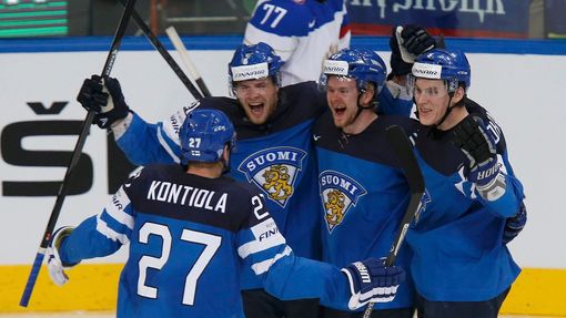 Finland's Iiro Pakarinen (2nd L) celebrates with his team mates Petri Kontiola (L), Ville Lajunen and Atte Ohtamaa (R) after scoring a goal against Russia during the firs