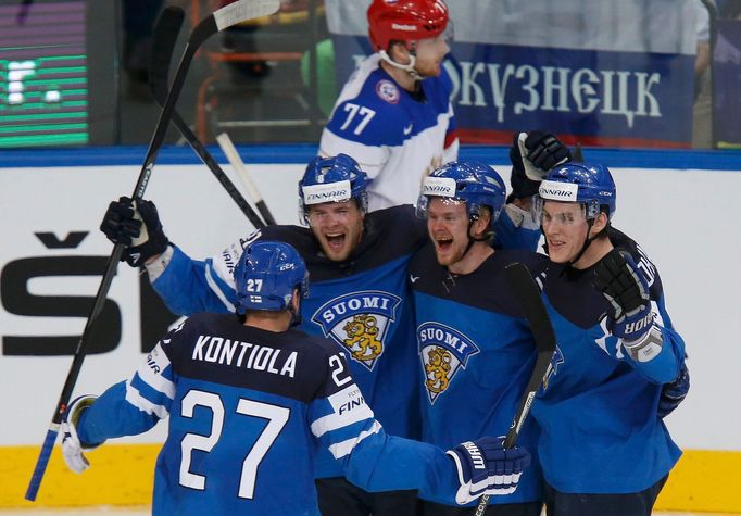 Finland's Iiro Pakarinen (2nd L) celebrates with his team mates Petri Kontiola (L), Ville Lajunen and Atte Ohtamaa (R) after scoring a goal against Russia during the firs