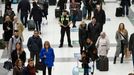 People pause to observe a minute's silence in memory of the victims of the Paris shootings, at Liverpool Street Station in London, Britain November 16, 2015.