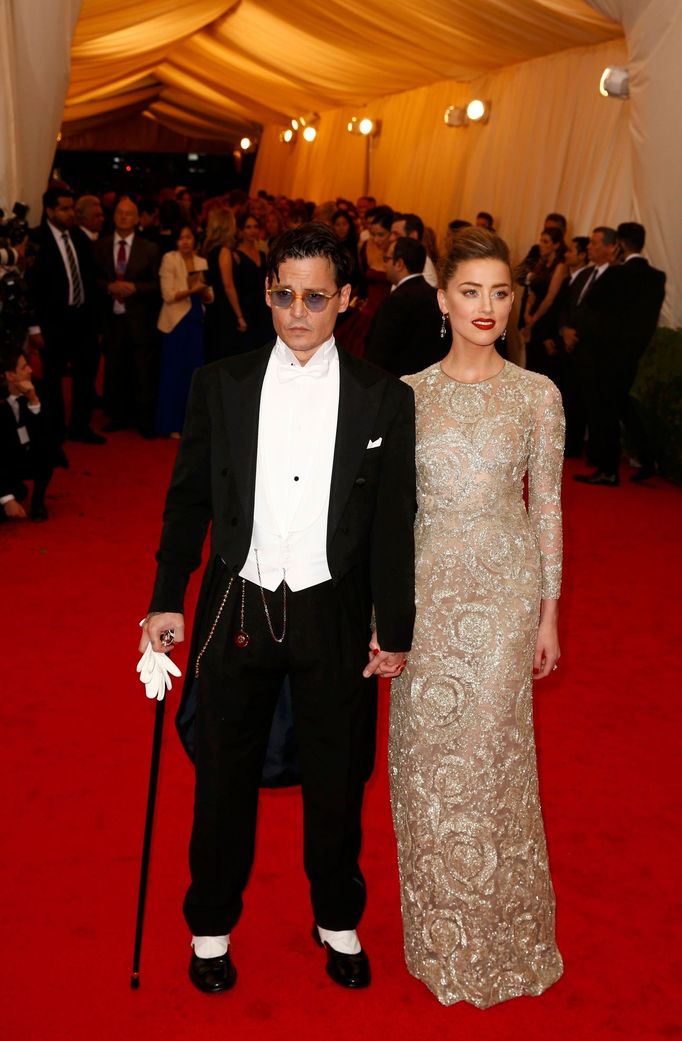 Actor Johnny Depp and his fiancee, model Amber Heard, arrive at the Metropolitan Museum of Art Costume Institute Gala Benefit celebrating the opening of &quot;Charles Jam