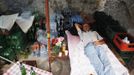 Nedzad Begovic rests in a restaurant in Potocari, near Srebrenica, July 6, 2012. Begovic and Slobodan Radakovic, both war survivors, make a living by putting together a restaurant selling roasted lamb. During the war, Bosnian Serb forces commanded by General Ratko Mladic killed up to 8000 Muslim men and boys in the Srebrenica area. Begovic lost 70 family members and Radakovic lost 10 family members. Picture taken July 6, 2012. REUTERS/Dado Ruvic (BOSNIA AND HERZEGOVINA - Tags: CONFLICT SOCIETY FOOD) Published: Čec. 8, 2012, 3:10 dop.