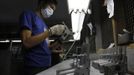 A former illegal gunsmith inspects a newly molded body of a caliber 45 pistol at Shooters Arms, a gun manufacturing company exporting different kinds of weapons to other countries, in Cebu city in central Philippines July 6, 2012. In the Philippines, they vote with their trigger fingers. Elections mean big business for illegal gunsmiths, who are looking forward to 2013 mid-term polls. With election-related violence commonplace, the Philippines imposes a ban on the carrying of guns for six months, from campaigning to the proclamation of winners. Picture taken July 6, 2012. To match Feature PHILIPPINES-GUNS/ REUTERS/Erik De Castro (PHILIPPINES - Tags: SOCIETY POLITICS BUSINESS CRIME LAW) Published: Čec. 29, 2012, 1:37 dop.