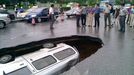 Van swallowed by sinkhole in road, Guilin, Guangxi Province, China - 07 Jun 2012 2012-06-07 00:00:00 Mandatory Credit: Photo by Quirky China News / Rex Features (1733870a) The van lying in the sinkhole Van swallowed by sinkhole in road, Guilin, Guangxi Province, China - 07 Jun 2012 The van driving along Fuxing Road was seen suddenly disappearing along with the forming of a giant sinkhole. Luckily, the driver only had slight injuries. Experts said the cave-in is due to the Karst landform in the region. When there is rain, the rising water underground may wash away the soil, causing a cave-in. The local public infrastructure company has refilled the sinkhole with soil.