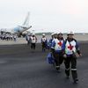Red Cross members arrive at Eloy Alfaro airport after an earthquake struck off Ecuador's Pacific coast, in Manta