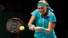 Petra Kvitova of the Czech Republic hits a return to Maria Sharapova of Russia during their WTA Finals singles tennis match at the Singapore Indoor Stadium October 23, 20