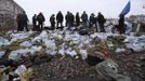 Anti-government protesters look out from a barricade in Kiev February 21, 2014.