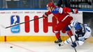 Finland's Leo Komarov (R) falls behind Russia's Dimitri Orlov (L) during the first period of their men's ice hockey World Championship group B game at Minsk Arena in Mins