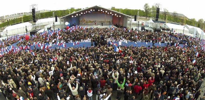 France's President and UMP party candidate for the 2012 French presidential elections Sarkozy salutes supporters at the end of a political rally on the place de la Concorde in Paris