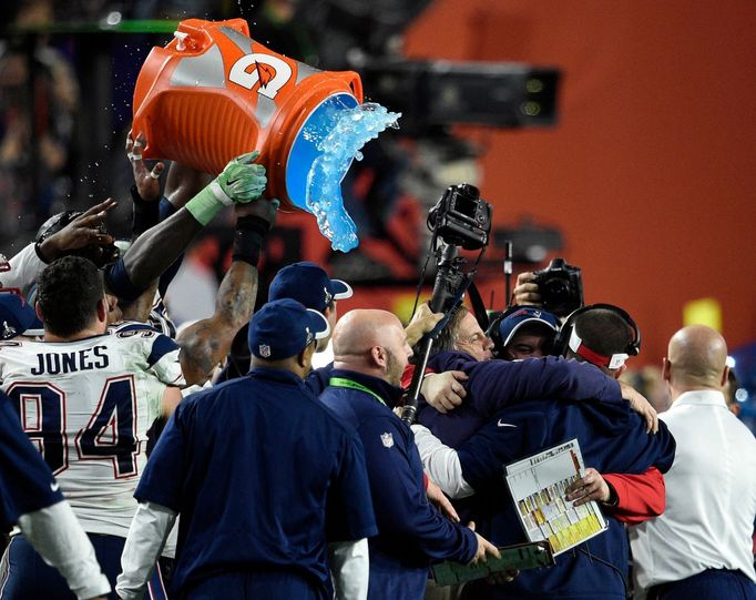 Feb 1, 2015; Glendale, AZ, USA; New England Patriots head coach Bill Belichick is dunked with Gatorade after defeating the Seattle Seahawks in Super Bowl XLIX at Universi