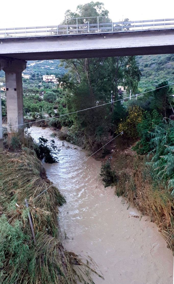 The swollen Milicia river runs in the area where nine people lost their lives when their home was flooded in Casteldaccia, near Palermo.