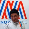 Manor Racing Formula One driver Haryanto of Indonesia stands outside his team's garage after the third testing session ahead the upcoming season at the Circuit Barcelona-Catalunya in Montmelo